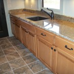 Maple and Granite Utility Room Sink and Cabinets